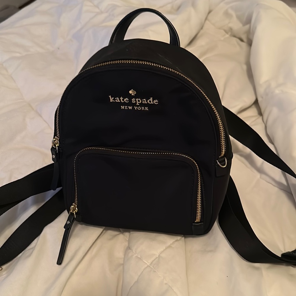 black with gold detailing kate spade mini backpack